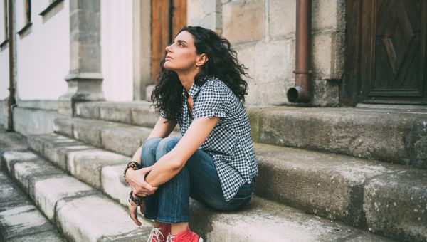 young woman sitting on stairs