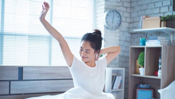 young woman waking up