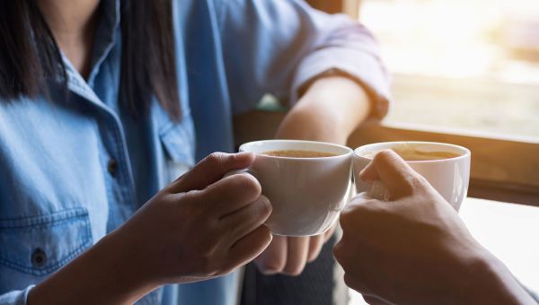 A new parent sharing coffee with a friend.