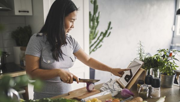 woman cooking with vegetables