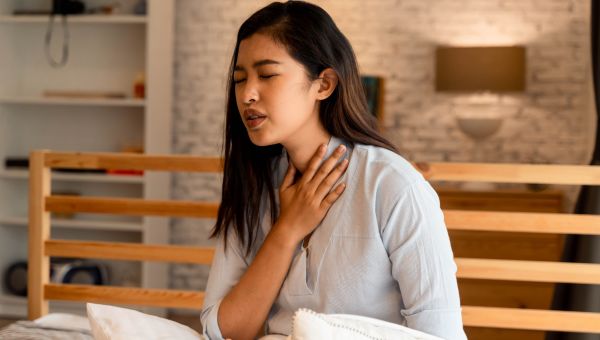 young adult woman with sore neck