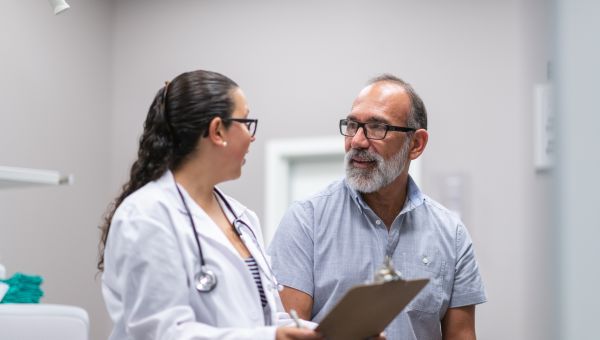 mature person talking to a doctor