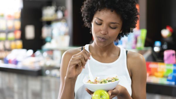 woman eating a healthy meal before workout