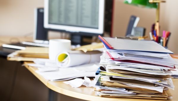 desk cluttered with papers