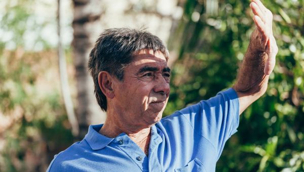 man blocking sunlight with hand