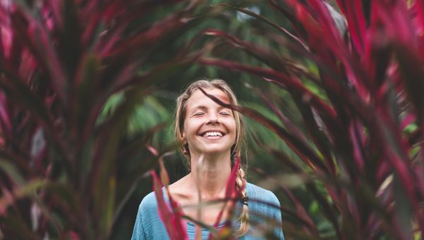 woman laughing in a garden