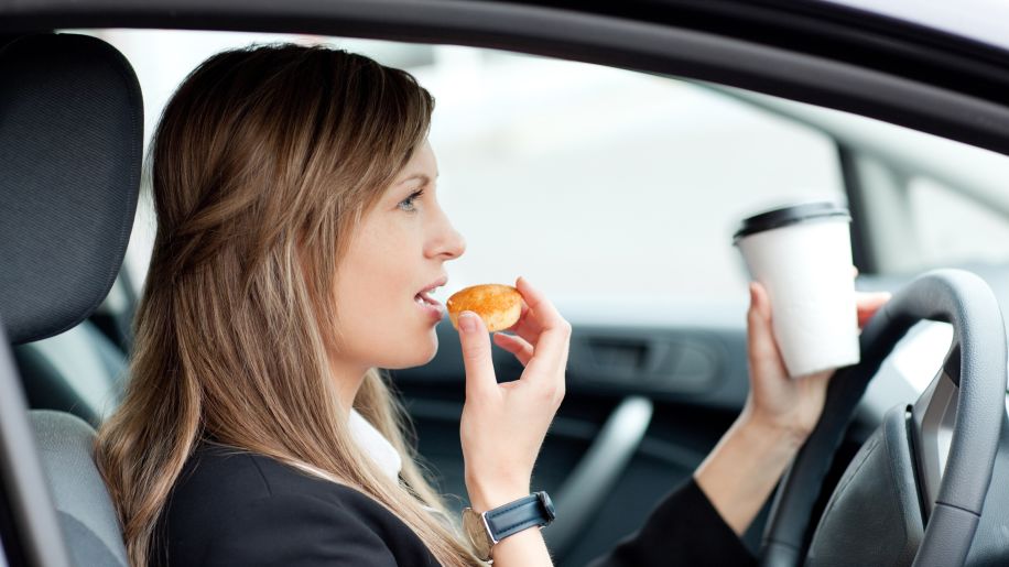 woman eating in car