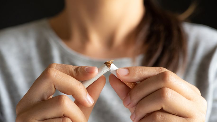 woman breaking a cigarette