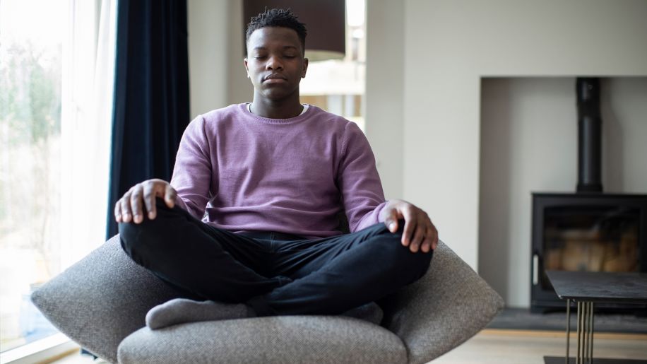 young man meditating