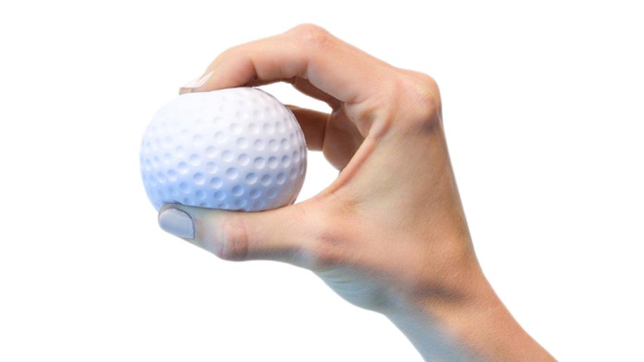 Person exercises hand by gripping a soft ball.