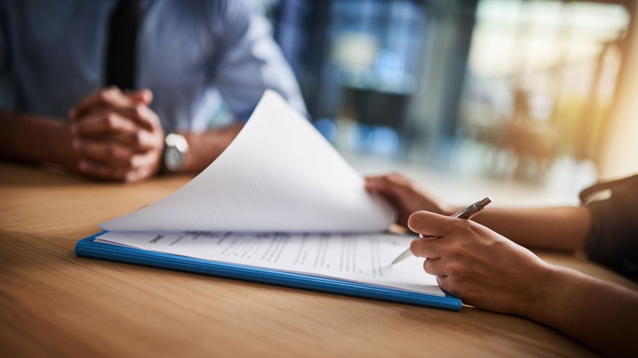 People completing paperwork