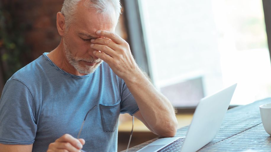Senior man experiencing financial stress