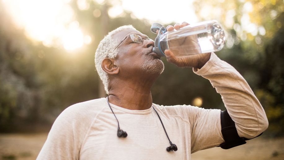 Senior man drinking water