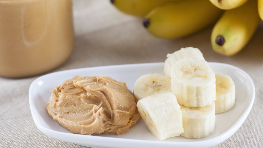 plate of banana slices with peanut butter