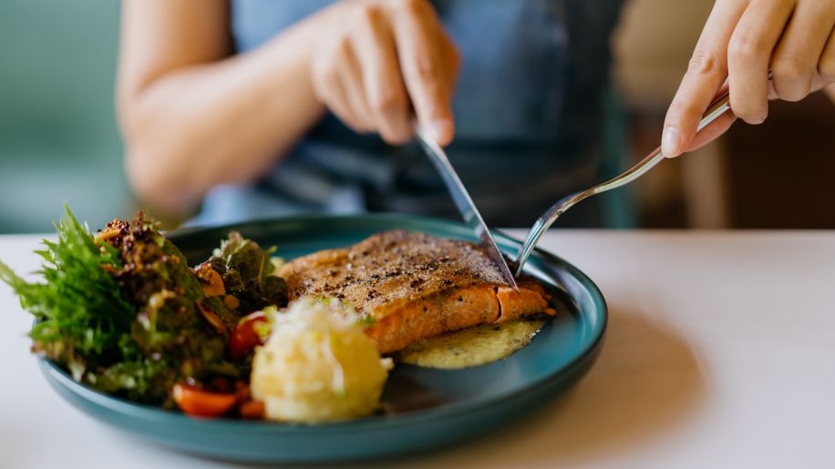 woman eating salad