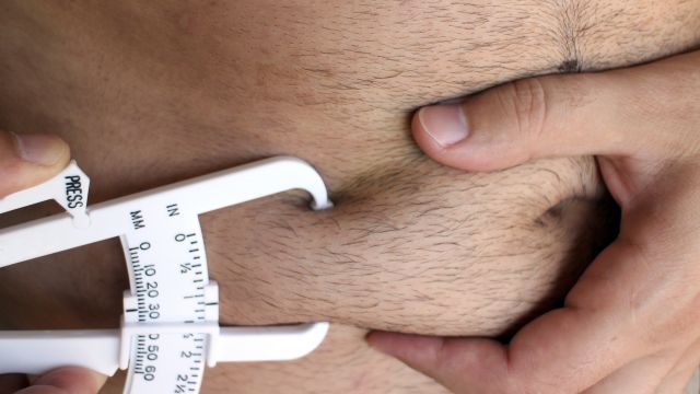 man checking body fat