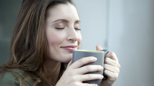 Caucasian woman drinking coffee