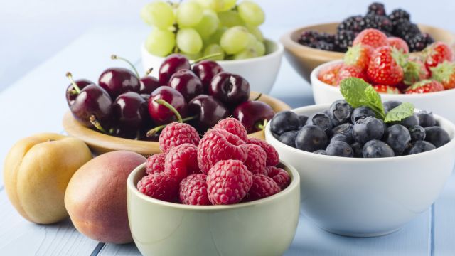 bowls of berries, cherries, blueberries, raspberries, grapes, strawberries, peaches, nectarines
