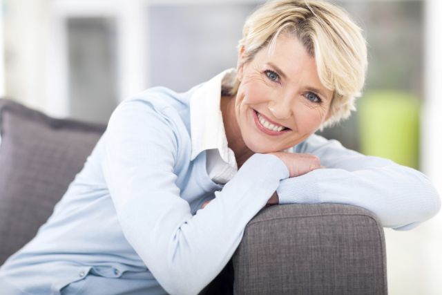 pretty senior woman relaxing on a couch