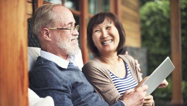 older asian couple laughing