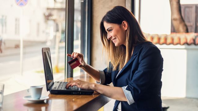 Happy woman doing online shopping
