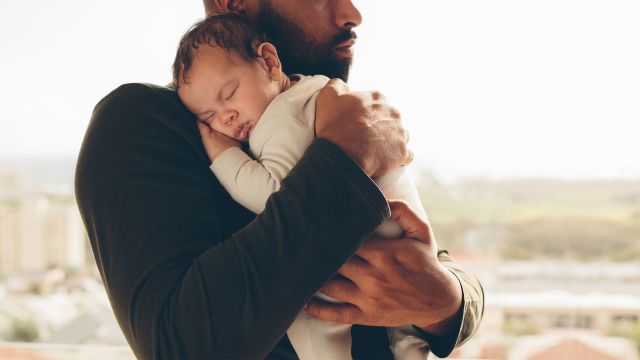 Man holding infant child