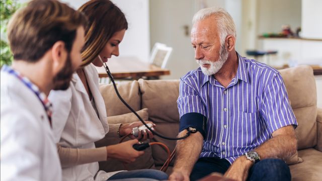 doctor checking blood pressure