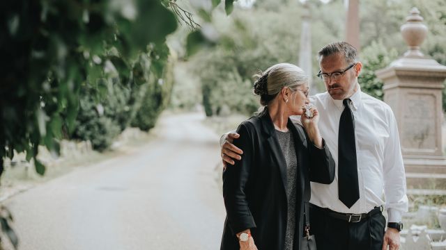 man comforting crying woman