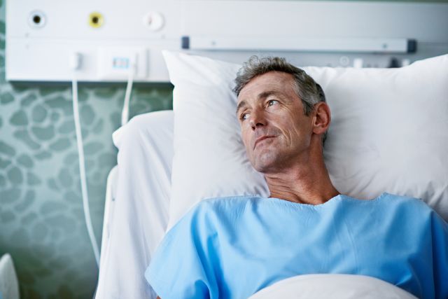 Middle-aged man in hospital bed