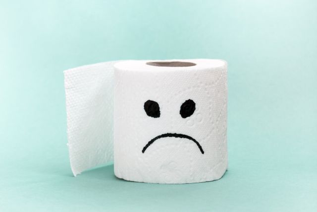 Frowning face on toilet paper indicates stomach or bowel problems; use the IBS symptom checker.