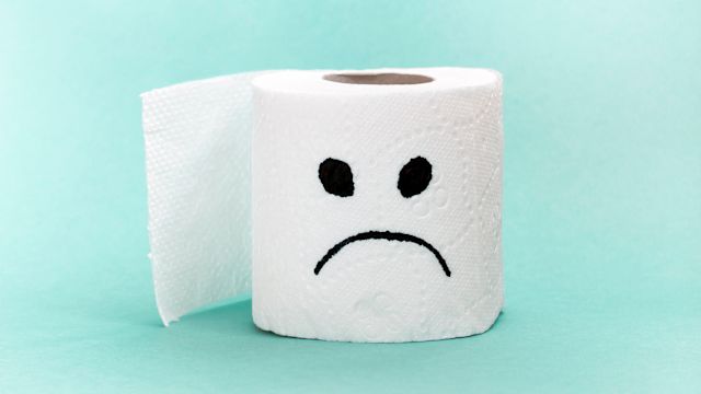 Frowning face on toilet paper indicates stomach or bowel problems; use the IBS symptom checker.