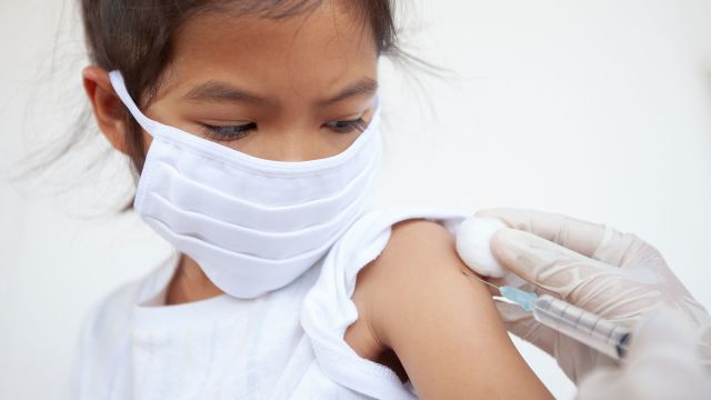 little girl getting a vaccination