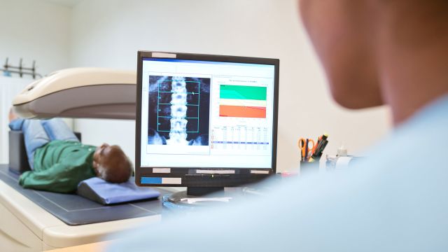 nurse conducting MRI scan