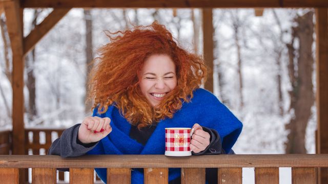 Young woman smiling in the snow
