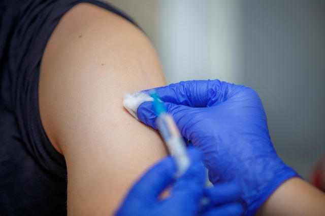 A woman receives the shingles vaccine. The vaccine is recommended for people who are 50 years of age and older.