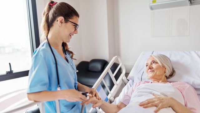 Elderly patient gets vitals checked in hospital.