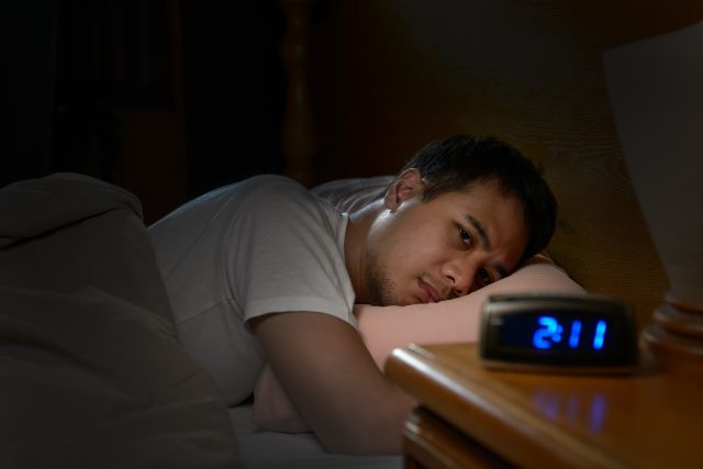 man facing insomnia