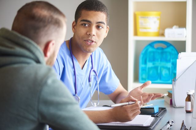 doctor speaking with patient