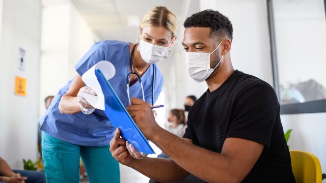 A doctor meets with her patient.