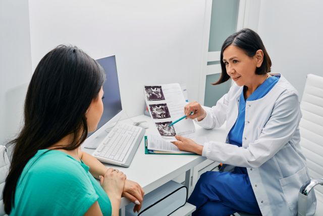 Adult woman getting consultation on her exam results and ovaries ultrasound from her gynecologist. 