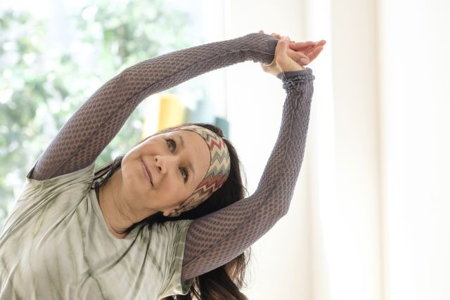 yoga exercise with mature woman, looking up