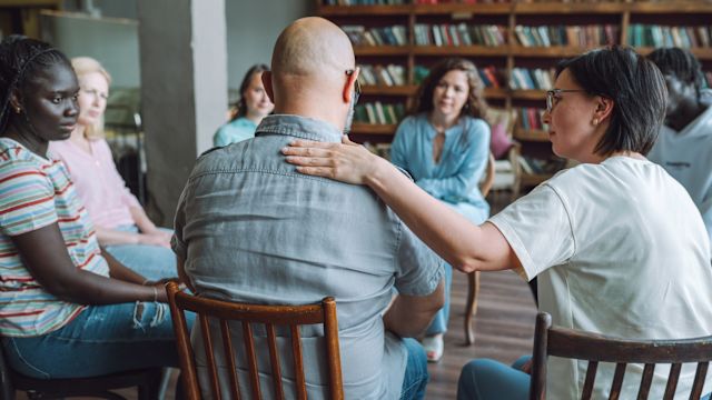 Friends listen and comfort each other at a support group for opioid use disorder. For people living with OUD, support groups offer the opportunity to connect with others who know what living with the condition can be like.
