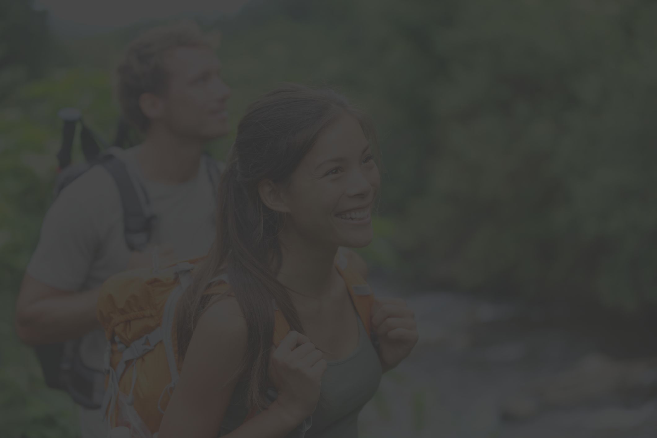 Woman and man hiking in summer