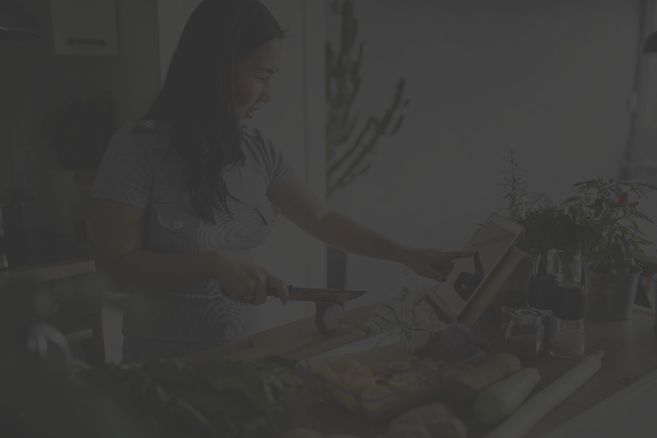 woman cooking with vegetables