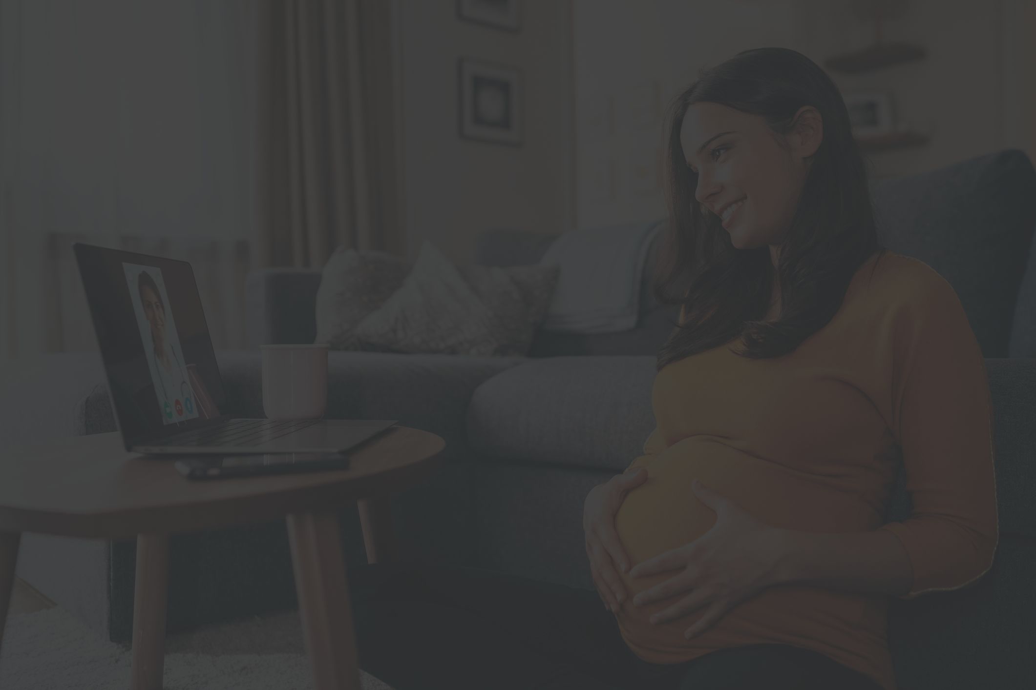 a pregnant woman as a telehealth consultation with her healthcare provider