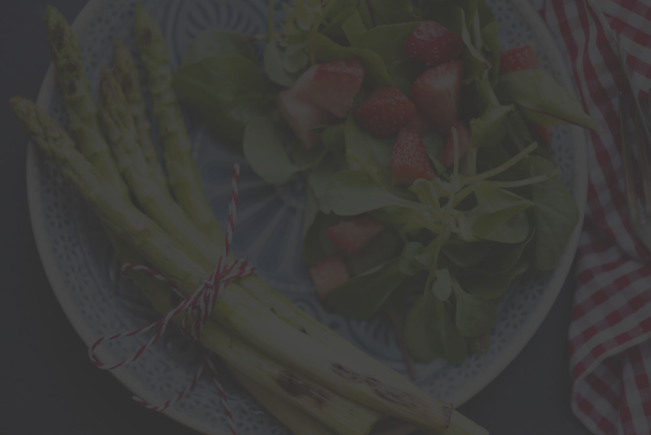 salad plate with asparagus and strawberries and greens