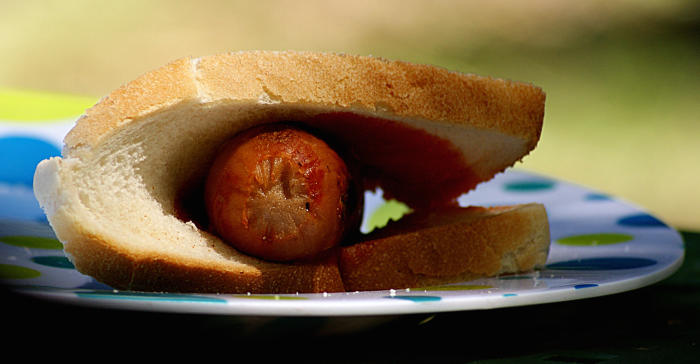 Sausage, sauce and bread – the staple fare at a summer BBQ. Picture: Bernard Spragg/Flickr