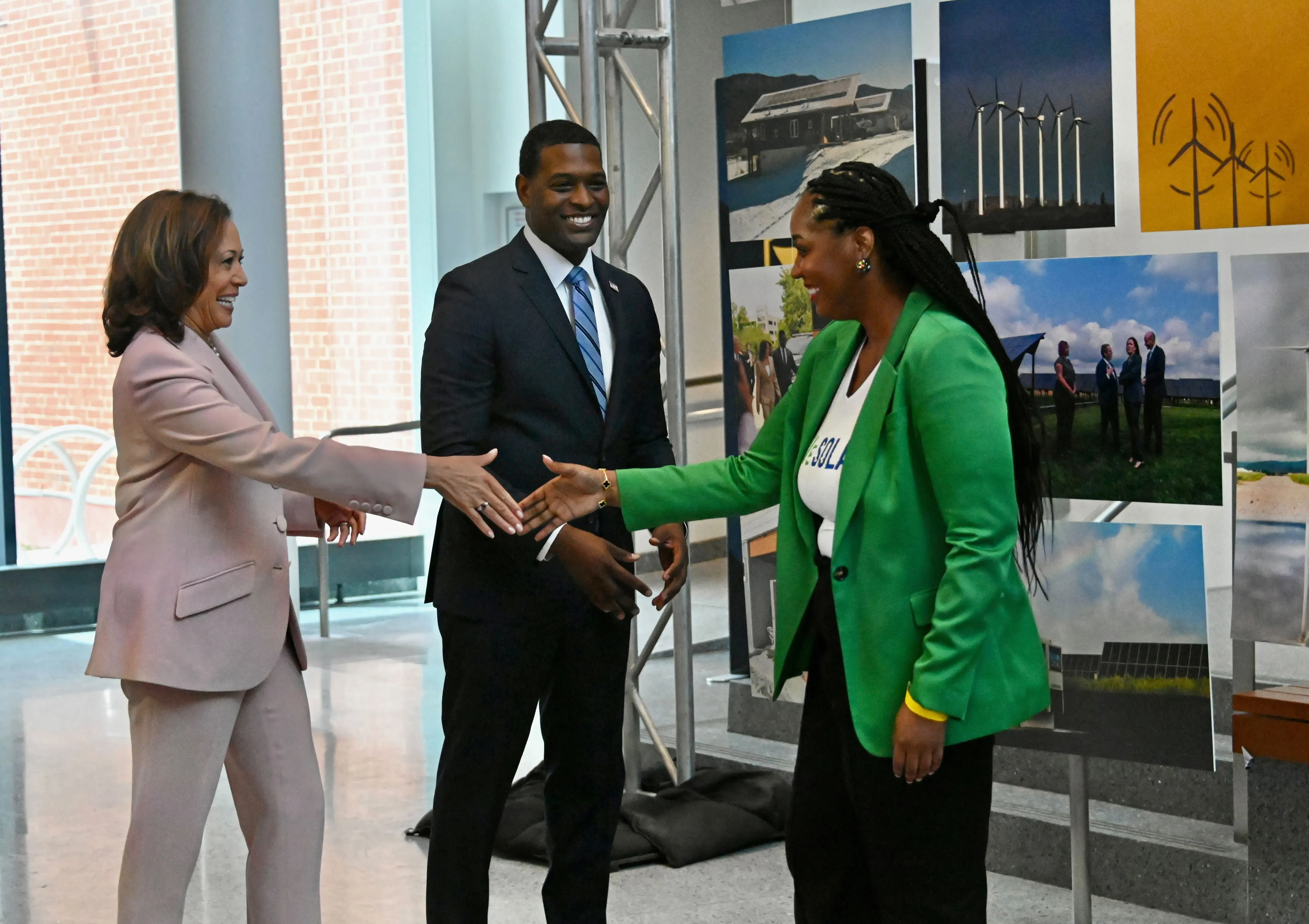 <span style="white-space: pre-wrap;">Vice President Kamala Harris and Environmental Protection Agency Administrator Michael Regan meet with local representatives at a briefing at the Coppin State University College of Business on Friday before the public announcement of two grant competitions under the Greenhouse Gas Reduction Fund to combat climate change. Harris shakes hands with Kristal Hansley, CEO and Founder of WeSolar.</span> <span style="white-space: pre-wrap;">Photo by Kim Hairston</span>