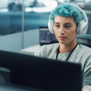 Headless is just a feature - woman working with headphones